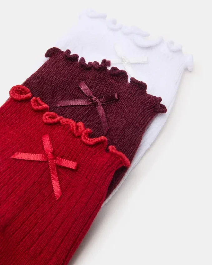 3-pack Melody-strumpor med spetskant och rosett, röda i flera färger 3-pack Melody-strumpor med spetskant och rosett, röda i flera färger
