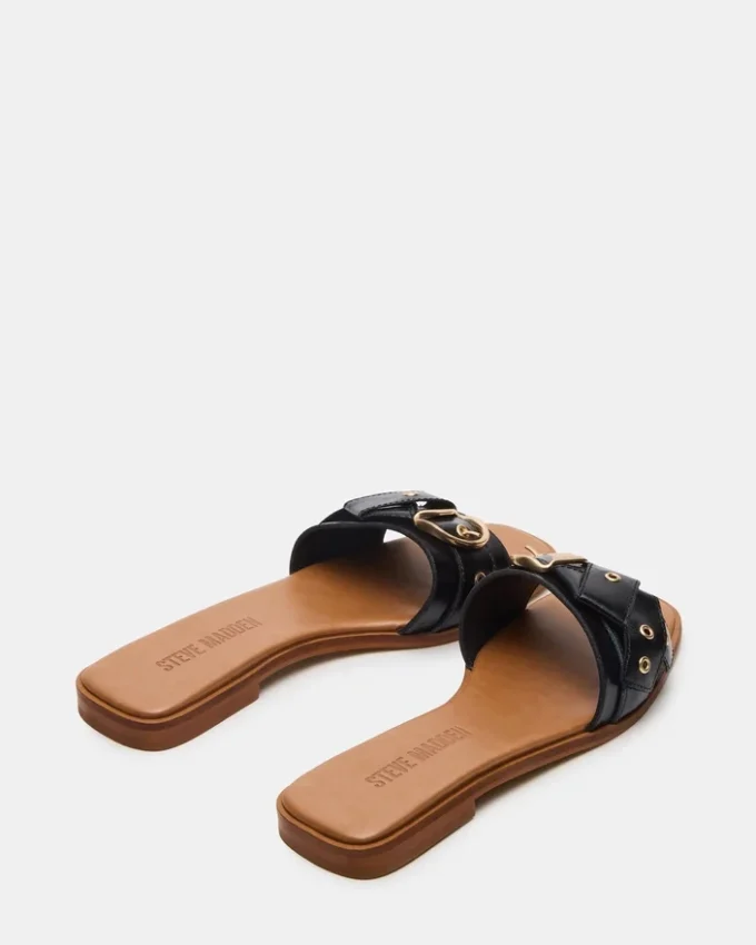 Hilaria i svart läder Hilaria i svart läder